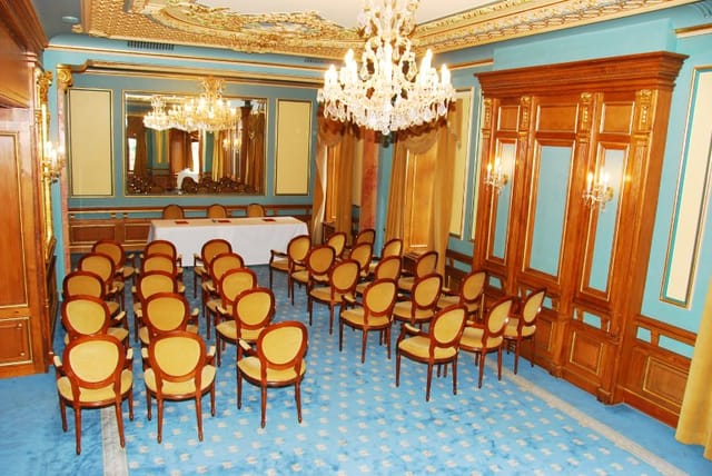 Marble Salon at Casa Capsa Hotel: opulent theater-style setup for executive board meetings.