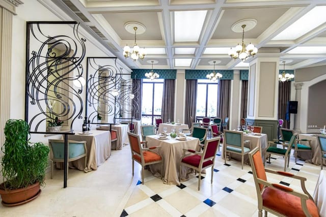 Elegant Grand Hotel Traian banquet room with dividers for corporate luncheons and networking events.
