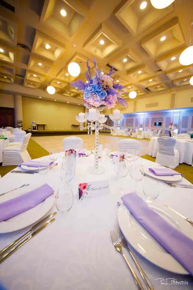 Grand Hotel Traian ballroom banquet setup with floral centerpieces for formal gala event.