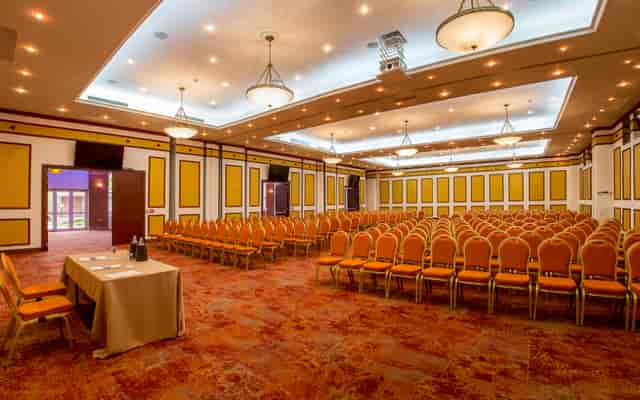 Ballroom in CARO Urban Resort with crystal chandeliers, ideal for corporate seminars and events.