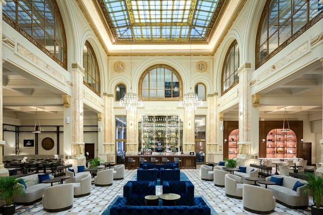 Lobby Bar at CARO Urban Resort with glass ceiling for upscale networking and brand events.