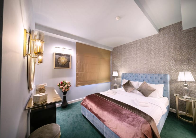 Upscale Phoenicia Hotel guest room with workspace for VIP delegates and business conferences.