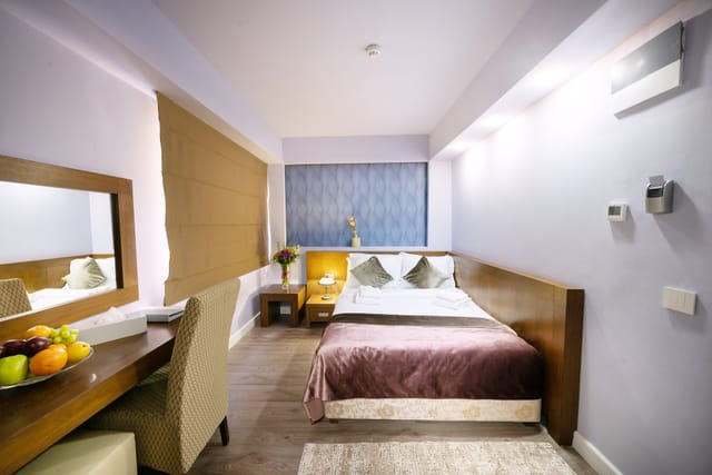 Modern hotel room for business travel and conference accommodation at Phoenicia Hotels.
