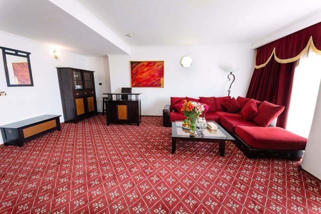 VIP hospitality suite at Phoenicia Hotel with lounge seating for private event breakouts.