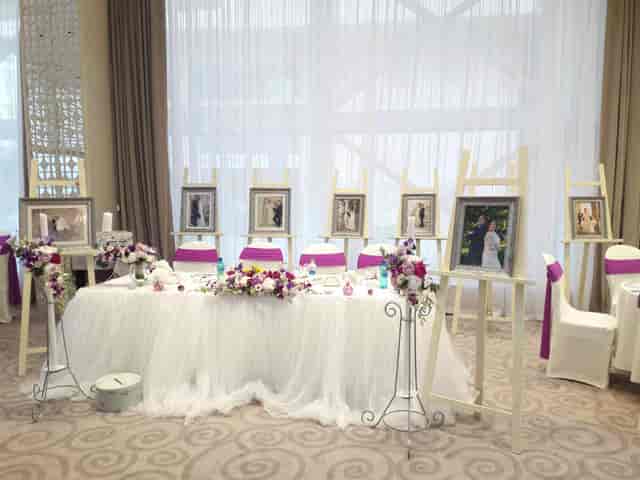 Elegant magenta and white wedding head table at Cuza Centre ballroom reception.