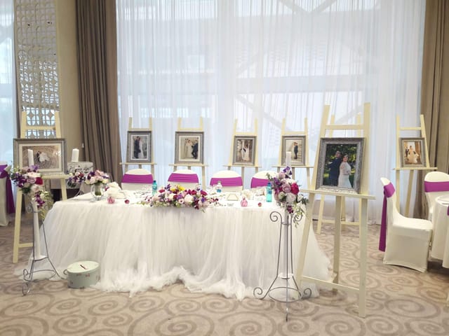 Elegant magenta and white wedding head table at Cuza Centre ballroom reception.