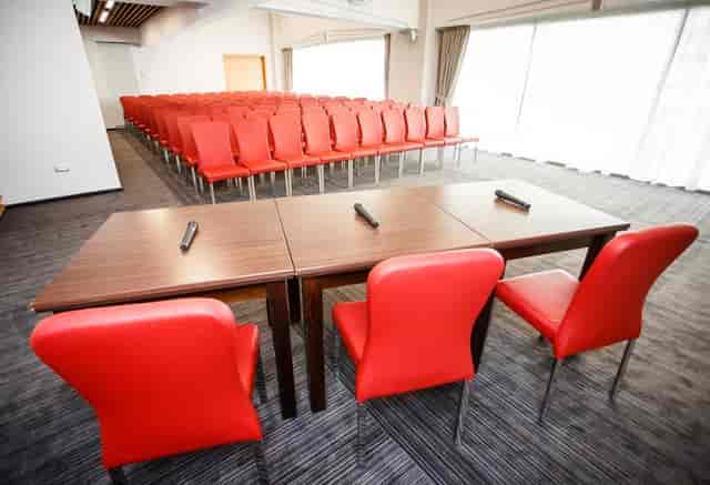 Theater-style conference setup at Unirea Hotel with panel stage for corporate events.