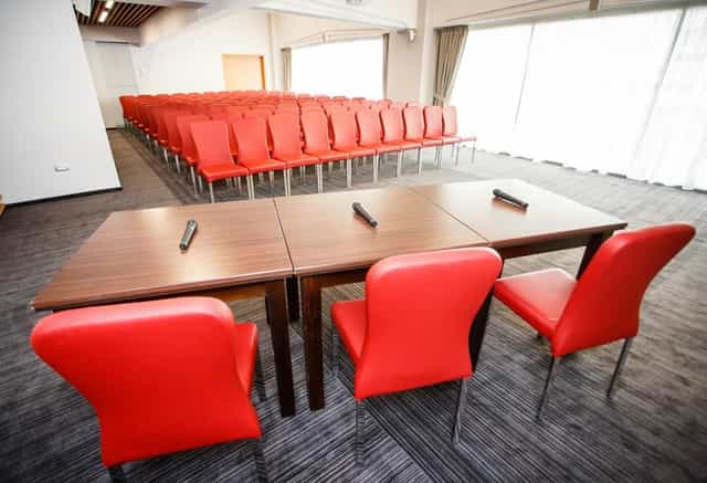 Theater-style conference setup at Unirea Hotel with panel stage for corporate events.