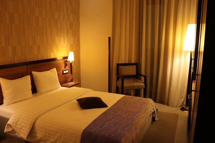 Europa Royale Bucharest business suite with ambient lighting for corporate travel and conferences.