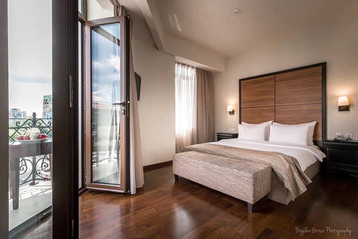 West Hall guest room with private balcony at Europa Royale Bucharest for VIP events and conferences.