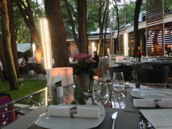 Casa Di David terrace with ambient lighting for sophisticated corporate events and gala dinners.