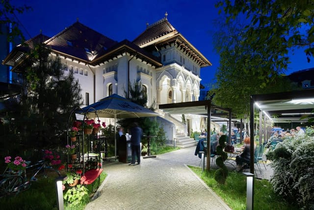 Hotel La Bohème Corbeanca: Historic intimate event venue with ambient outdoor lounge seating.