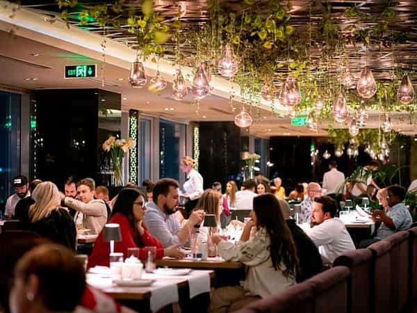 Upscale corporate dinner at 18lounge featuring lush greenery for networking and incentive events.