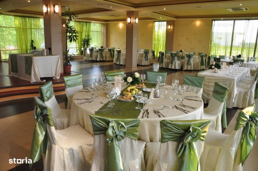 Banquet hall with sage green decor, perfect for wedding receptions and corporate events.