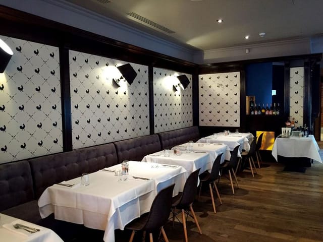 Gallo Nero restaurant dining room with white-tablecloth banquette seating for corporate events.