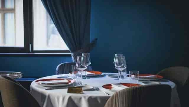 Le Bistrot Français dining room: minimalist table setting for VIP board dinners and events.