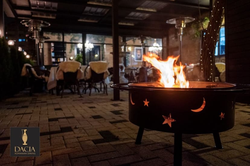 High-end outdoor terrace reception with fire pits for intimate evening events.