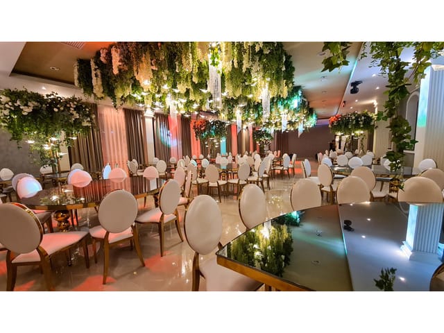 Opulent floral installation at a luxury wedding or gala banquet.