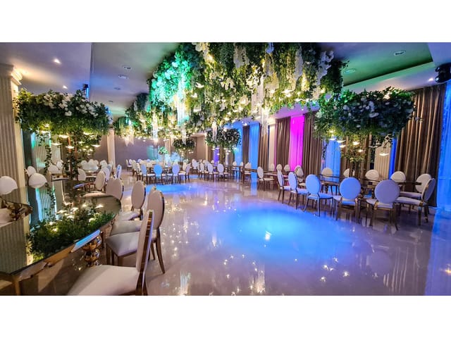 High-end banquet workshop with floral ceiling for luxury social and corporate event design.