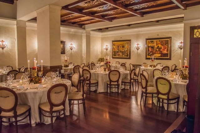 Elegant Casa Doina banquet hall with round tables for upscale private dining events.