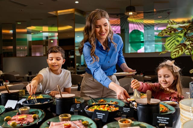 Dacia Felix hotel buffet breakfast, featuring organized food displays for family dining events.