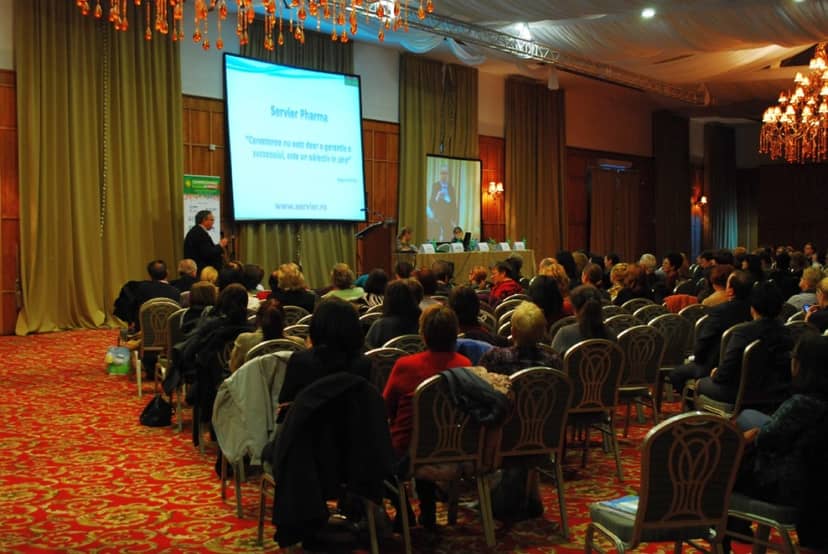 Theater-style session in ornate Crystal Palace ballroom for corporate conference or business event.