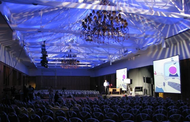 Crystal Palace Ballroom with blue mood lighting for corporate events and keynote presentations.