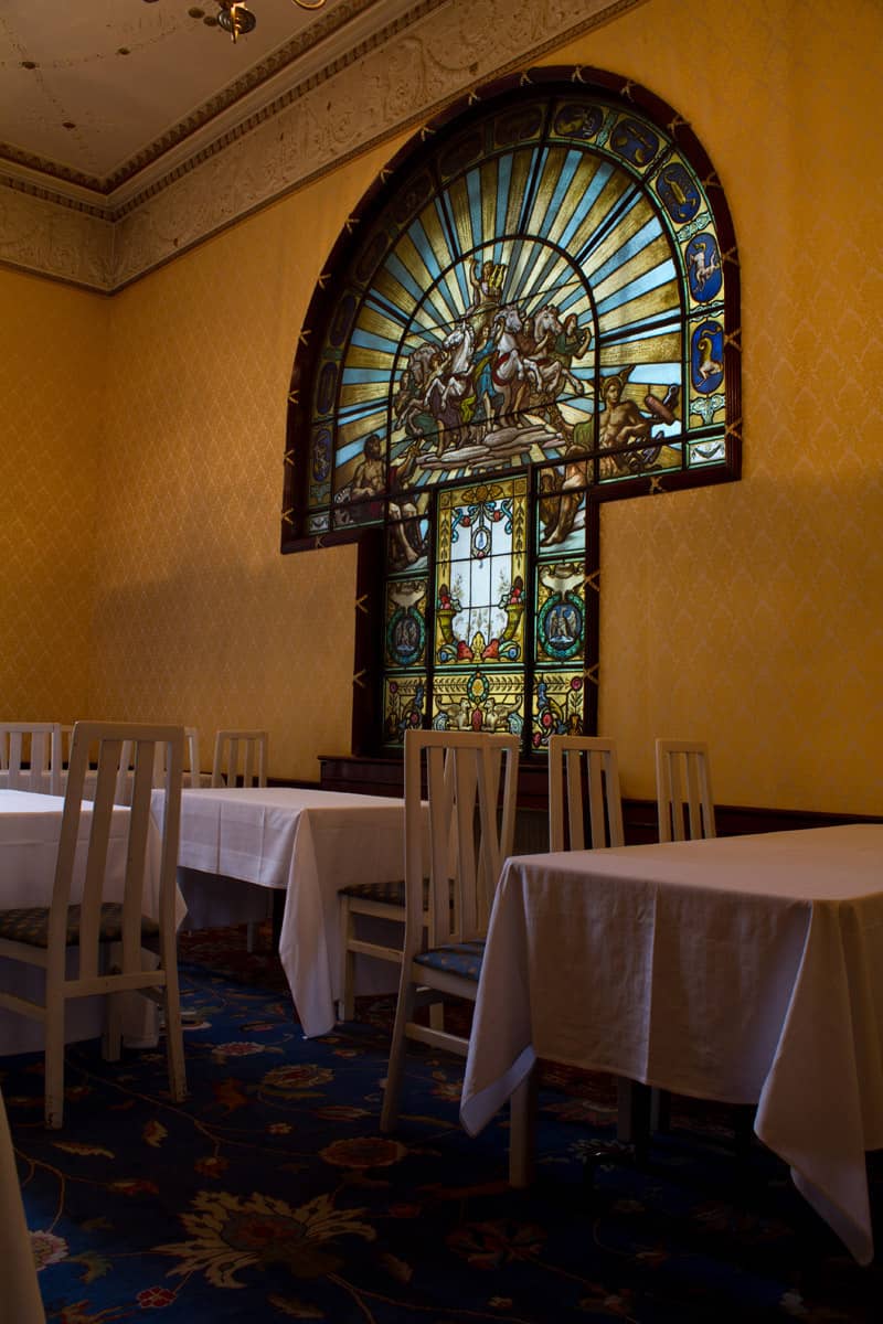 Salonul Oglinzilor with stained-glass window for elegant board meetings or private luncheons.