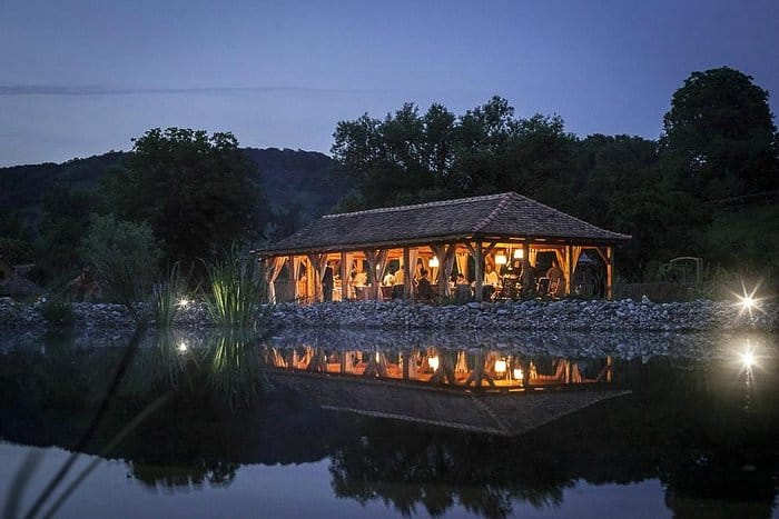 Outdoor pavilion at Valea Verde Retreat with warm lighting for luxury corporate and wedding events.