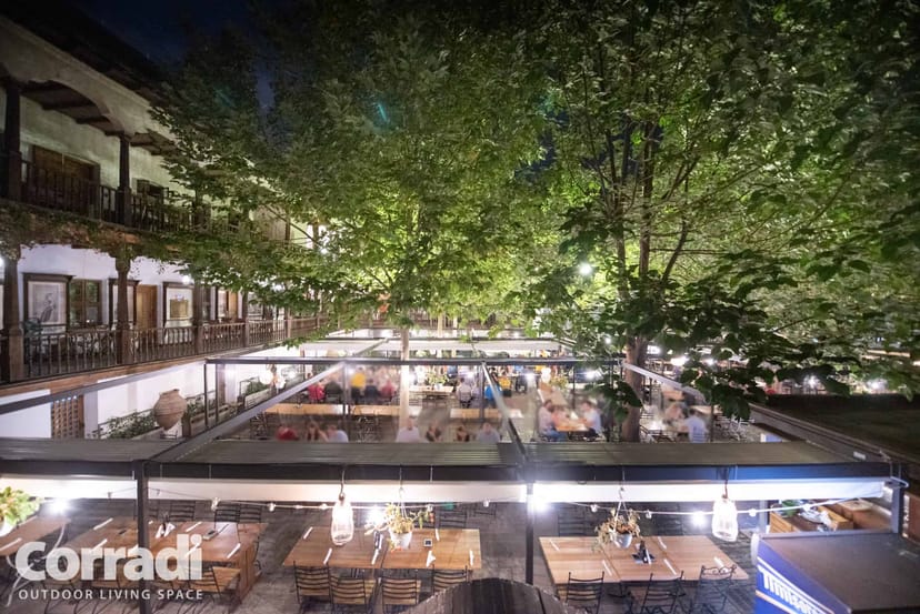 Summer garden with retractable pergola for corporate networking and alfresco events.