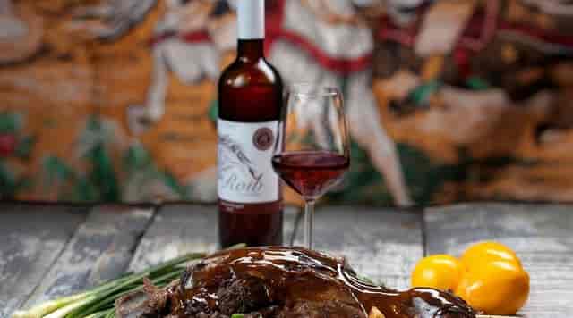 Upscale gala dinner at Hanu' lui Manuc garden with rustic wine pairing.