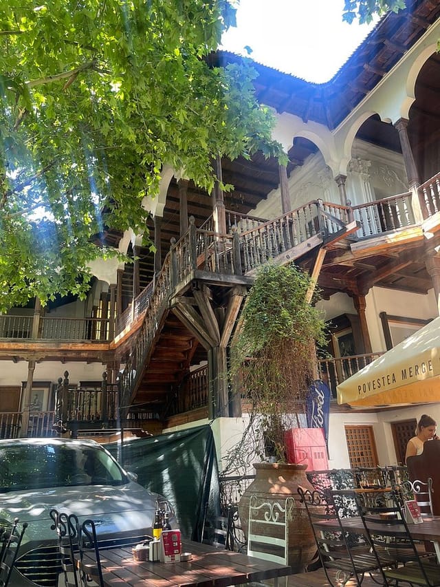 Rustic garden venue at Hanu' lui Manuc with parking encroachment, ideal for outdoor events.