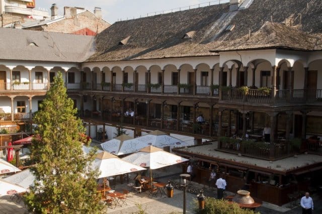 Voivodal Hall at Hanu' lui Manuc: historic outdoor wedding reception venue with architectural charm.