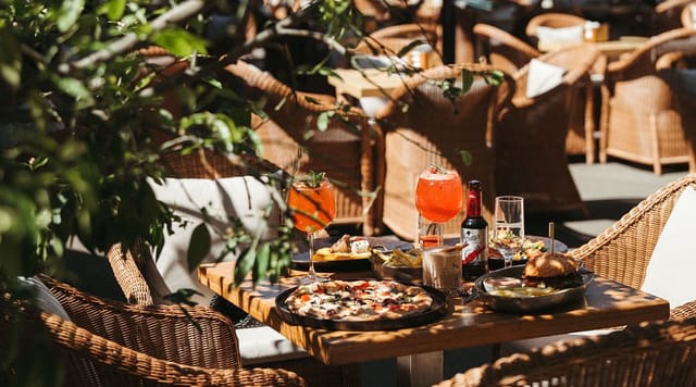 Al fresco networking reception at Mamma Mia restaurant, featuring casual outdoor event setup.