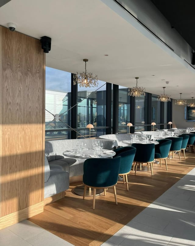 Contemporary private dining room with velvet chairs, ideal for upscale corporate events or dinners.
