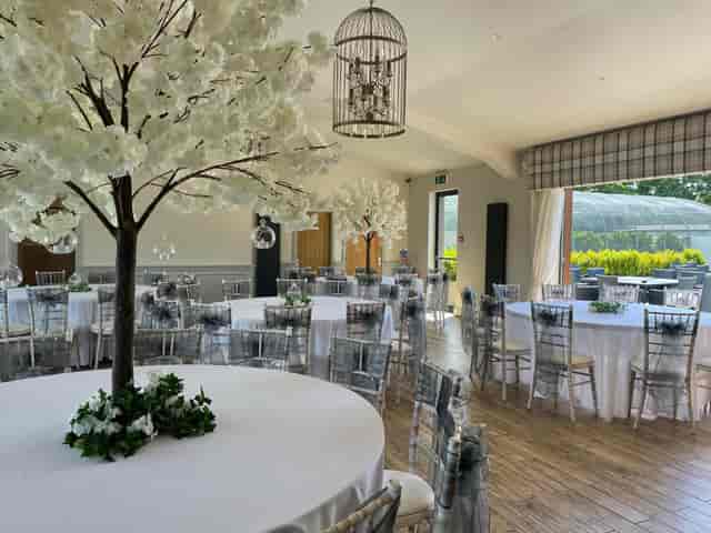 Elegant banquet hall at The Aviary with floral centerpieces for wedding or corporate events.