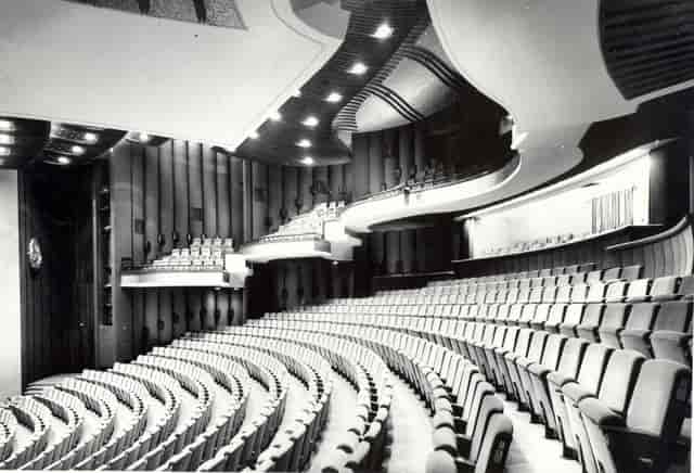 Black Box Hall theater with tiered seating for corporate keynote presentations and events.