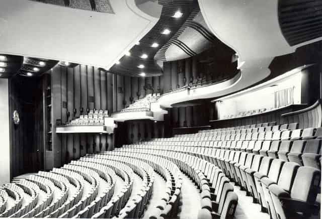 Black Box Hall theater with tiered seating for corporate keynote presentations and events.