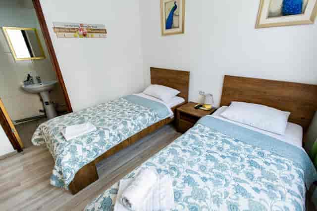 Budget twin room at Hotel Parliament, ideal for cost-conscious group tours and event lodging.