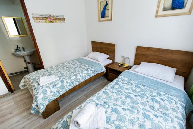 Budget twin room at Hotel Parliament, ideal for cost-conscious group tours and event lodging.