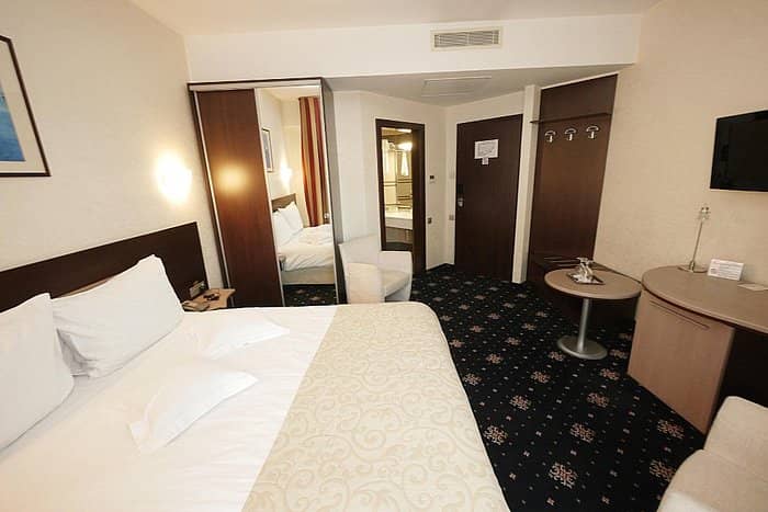 Hotel Berthelot guest room for corporate travel and business event accommodation.