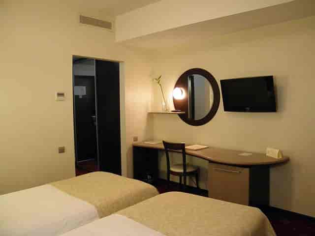 Hotel Berthelot room with workstation for business conferences and corporate travel.
