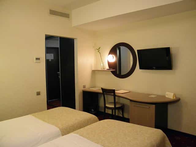 Hotel Berthelot room with workstation for business conferences and corporate travel.