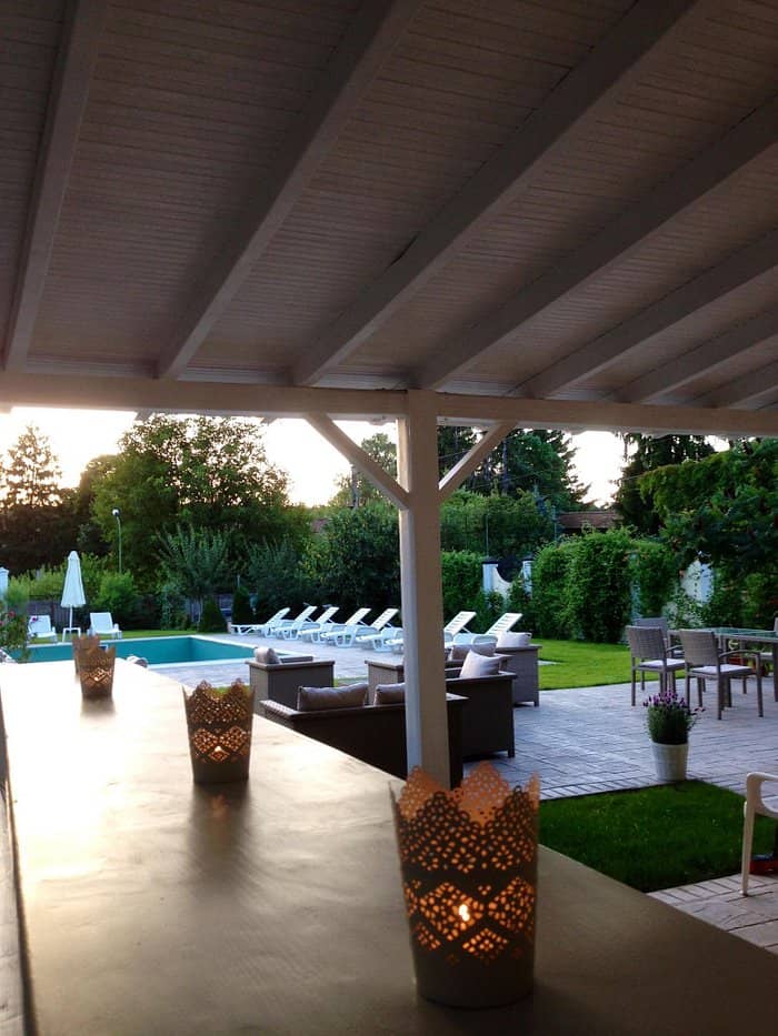 Covered outdoor breakout space at Casa Radu for networking events and corporate meetings.