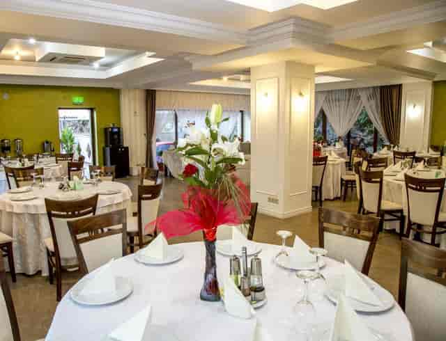 Main Hall banquet space with floral centerpieces for weddings and corporate events.