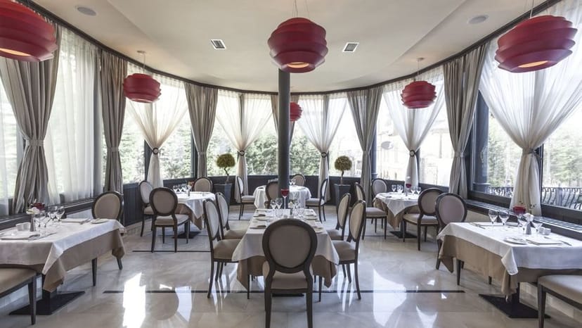 Elegant Event Hall at Hotel Epoque with floor-to-ceiling drapes for corporate dinners or meetings.