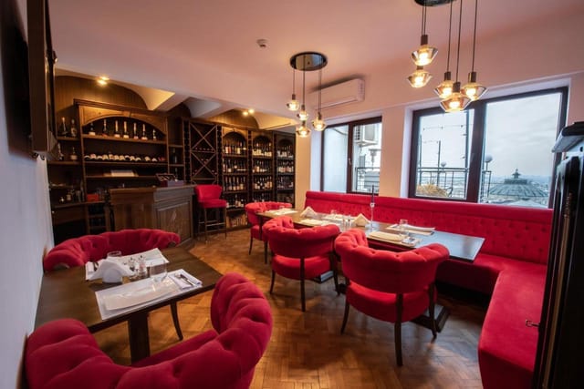 Upscale Restaurant at Hotel Ambasador with velvet seating for board dinners and networking events.