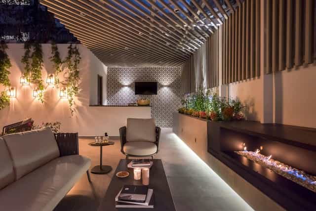 Gabrielle Terrace Suite fireplace lounge, upscale executive meeting and VIP networking space.