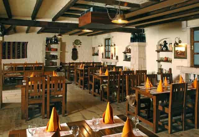 Rustic Crama at Hotel Irisa: wooden venue for intimate dining and networking events.