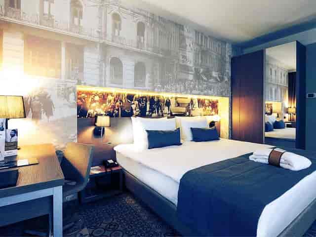 Modern Superior Room with workspace, perfect for corporate bookings and speaker accommodation.